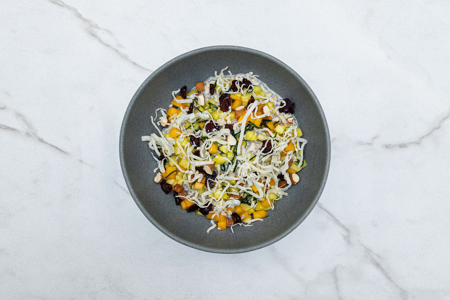 Chia Overnight Oats Topped with Coconut, Pina, and Cranberry